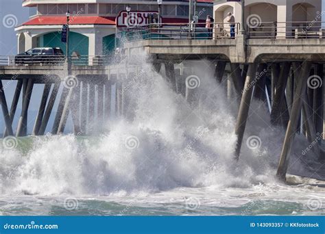 Waves Crashing Under The Huntington Beach Pier Editorial Photography