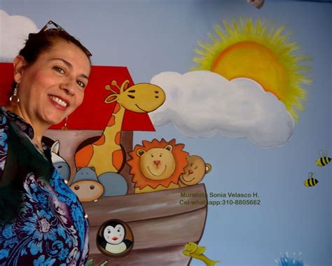 A Woman Standing In Front Of A Wall Painting With Animals And A Boat On It