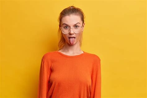 Free Photo Funny Millennial Girl Being Naughty Sticks Out Tongue