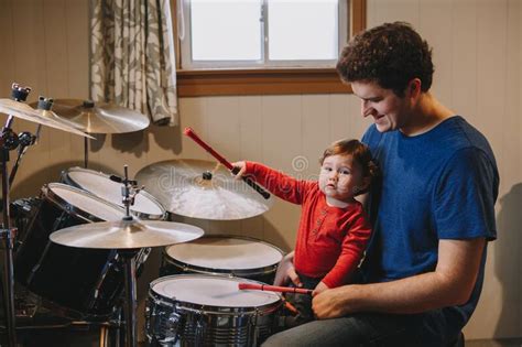 Father Teaching Baby Boy To Play Drums Parent With Toddler Child