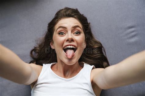 Image Of Amusing Woman Showing Her Tongue And Taking Selfie Photo Stock Image Image Of