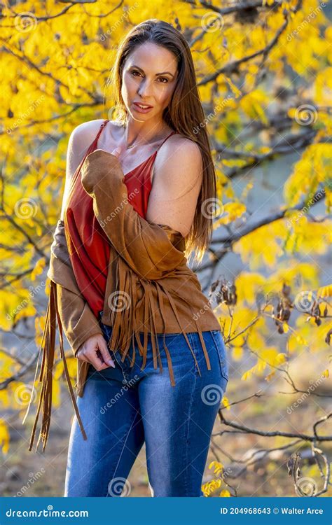 a lovely brunette model poses outdoor while enjoying the fall weather stock image image of
