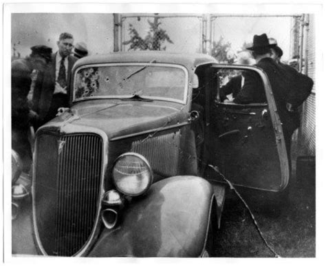 Officers Inspect The Couples Bullet Riddled V8 Ford Car Bonnie And