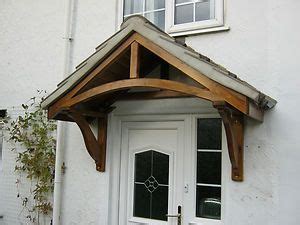 Porch canopies are often a lot less expensive than constructing a new porch roof on a home or a roof over a patio or deck as well. Timber door canopy / porch kit | Door canopy porch, Porch ...