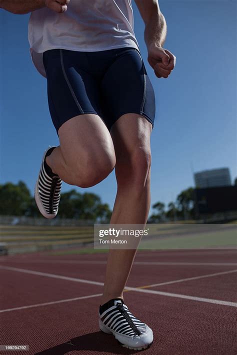 Runner Running On Track High Res Stock Photo Getty Images