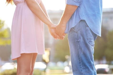 Premium Photo Young Couple Holding Hands Together