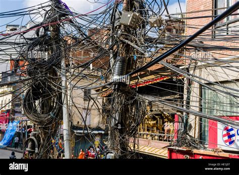 Chaotic Electrical Supply By Hundreds Of Wires Wrapped Around Poles