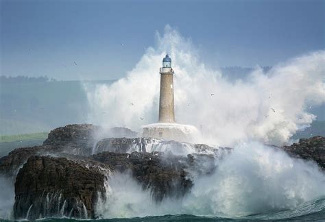Waves Crashing Around Lighthouse Photograph By Sergio Saavedra Fine