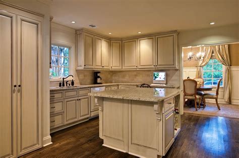 Large kitchen remodeling with white furniture and dark flooring. How to Remodel Your Kitchen Design with Home Depot Service ...