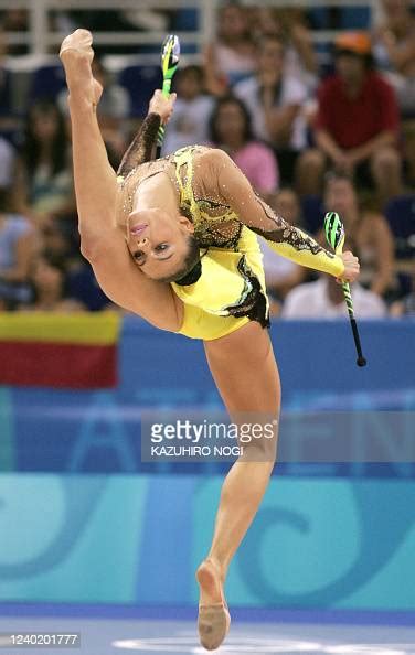 Alina Kabaeva Of Russia Performs With Clubs At The Gymnastics News