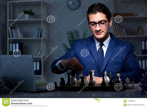 The Businessman Playing Chess In Strategy Concept Stock Photo Image