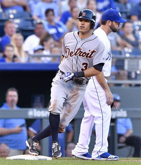tigers second baseman ian kinsler reaches third in front of royals third baseman mike moustakas