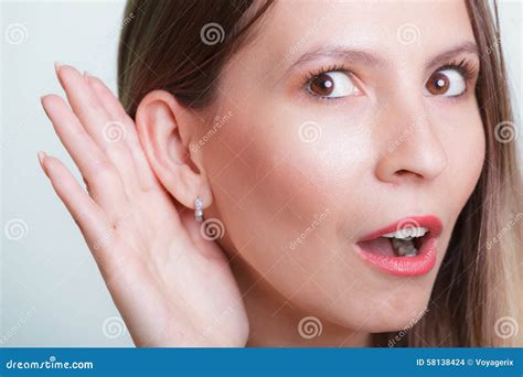 Shocked Gossip Girl Eavesdropping With Hand To Ear Stock Photo Image