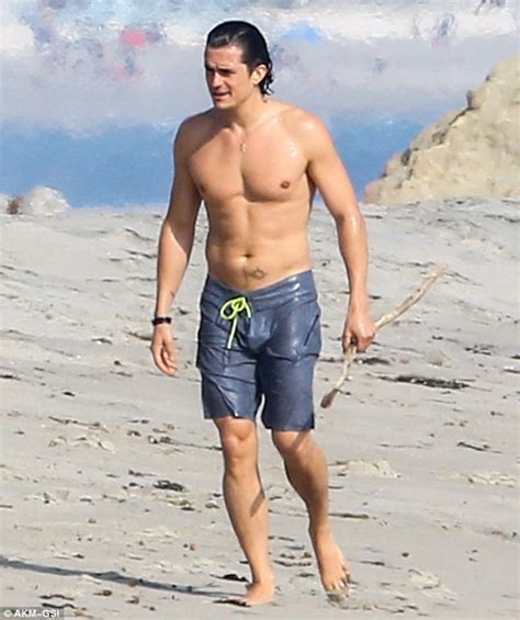 Orlando Bloom Reveals Chiseled Pecs And Toned Abs As He Strips To His