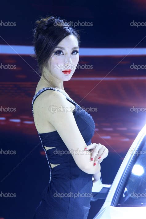 beautiful female model in a car exhibition china stock editorial photo © junrong 32152037