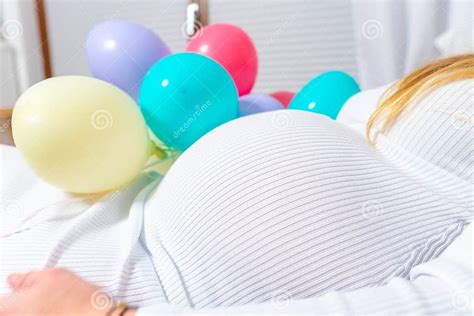 Pregnant Woman Belly And Balloons Isolated On White Pregnancy Concept