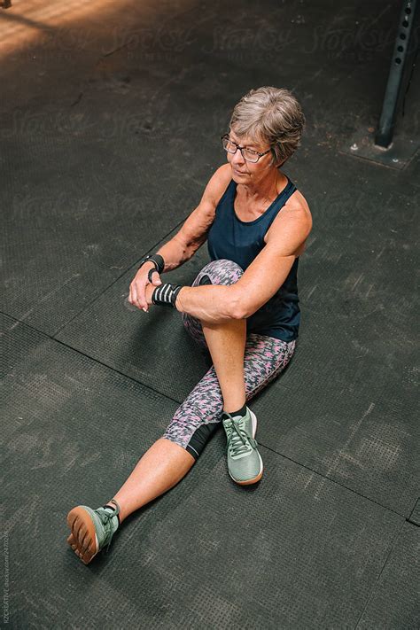 Senior Woman Stretching At Gym By Stocksy Contributor Rzcreative Stocksy