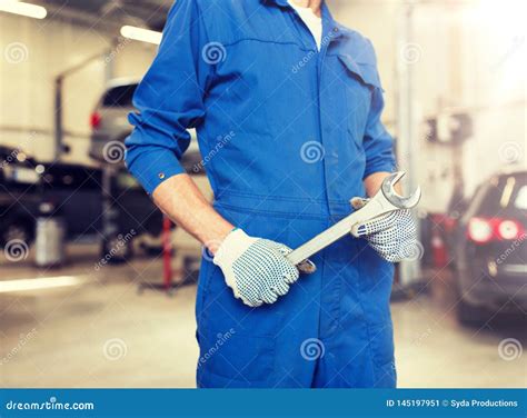 Auto Mechanic Or Smith With Wrench At Car Workshop Stock Image Image