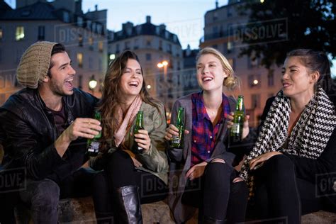 Friends Having Beers Together Outdoors Stock Photo Dissolve