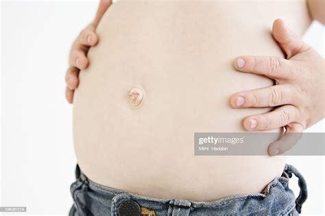 Child In Jeans Showing His Belly Button High Res Stock Photo Getty Images