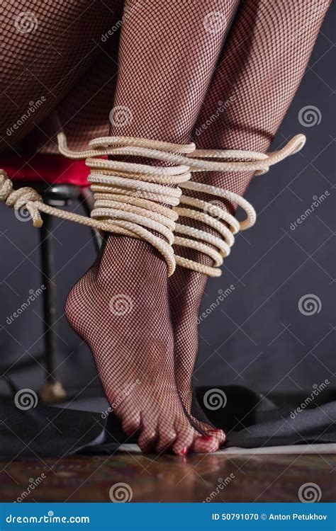 Woman With Tied Legs Stock Photo Image Of Loops Background 50791070