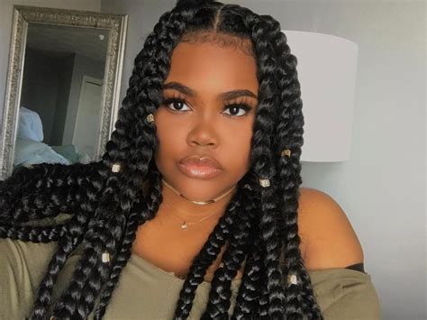 All the cool girls are rocking space buns this summer, and now it's your turn. The Top 10 Summer Braid Hairstyles for Black Women - Mane Guru