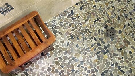 Pebbles, including river stones and glass pebbles, bring a dash of color and variety to your shower. Aquatic Vibe
