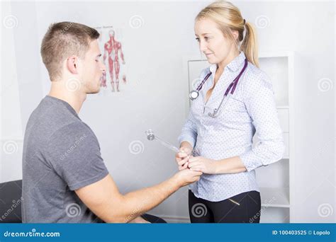Doctor Examining Her Patient In Medical Office Stock Image Image Of Female Massaging