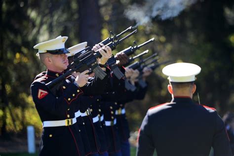 A Us Marine Corps Honor Guard Conducts A 21 Gun Salute In Honor Of