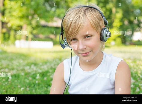 Boy With Headphones Outdoors Stock Photo Alamy