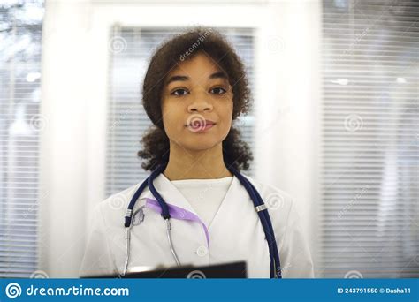 Happy African American Female Doctor Physician Wearing Medical Uniform