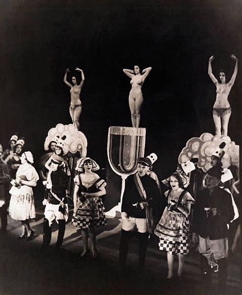 An Old Black And White Photo Of People In Costume