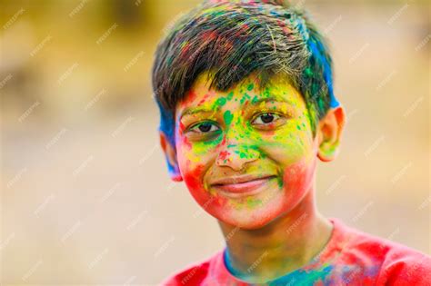 Premium Photo Holi Celebrations Indian Little Boy Playing Holi And