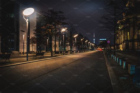 Long empty city street at night | Architecture Stock Photos ~ Creative