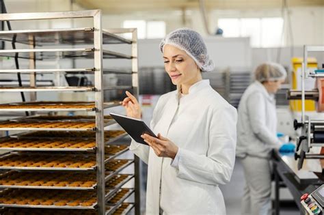 Premium Photo A Food Factory Supervisor Is Doing Quality Control Of
