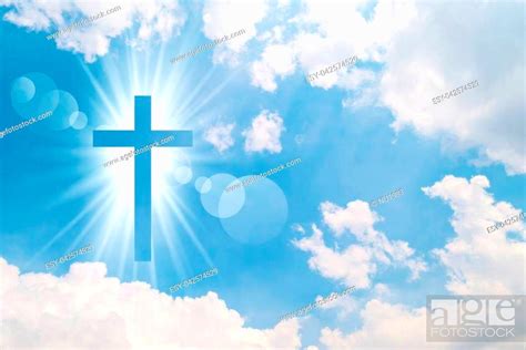 Christian Cross Appears Bright In The Sky Background Stock Photo