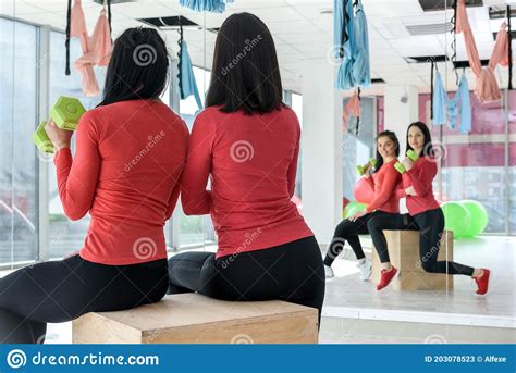 Training Together Portrait Of Two Fit Young Women Exercising On