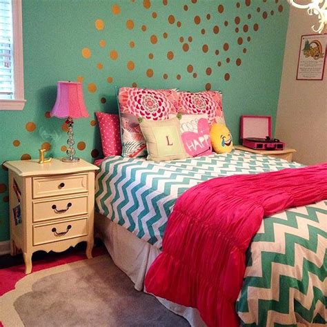 A Bedroom Decorated In Pink Green And Gold With Polka Dots On The Wall