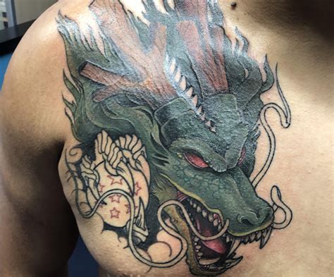 Black 4 star dragon ball tattoo. Progress shot of shenron done by Chris Sparks at Electric Rideo Tattoo Austin Texas : dbz