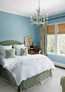 A sea blue rug and white walls and beams create a light and airy feel in this bedroom. 25 Stunning Blue Bedroom Ideas