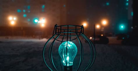 Person Holding Turned On Light During Nighttime · Free Stock Photo