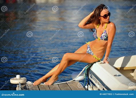 Seductive Model Wearing Stylish Swimwear And Sunglasses And Posing On