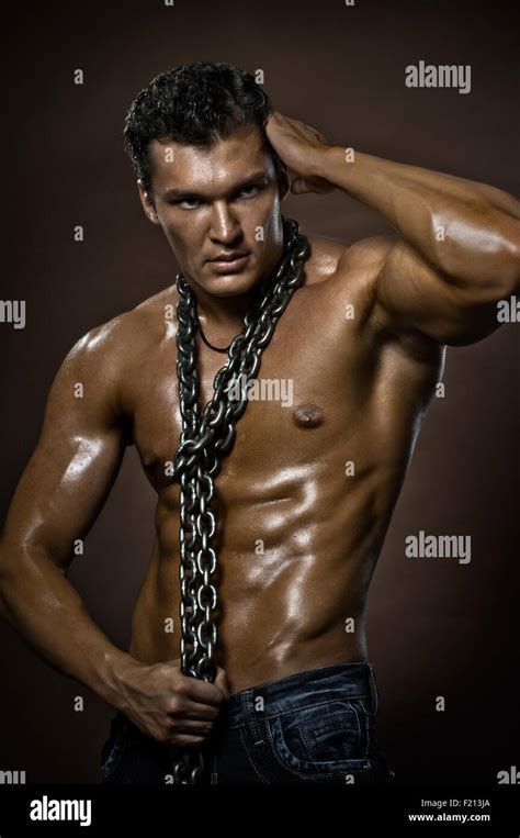The Very Muscular Handsome Sexy Guy On Brown Background Naked Torso Stock Photo Alamy
