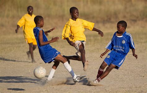 Children Playing Soccer In Africa