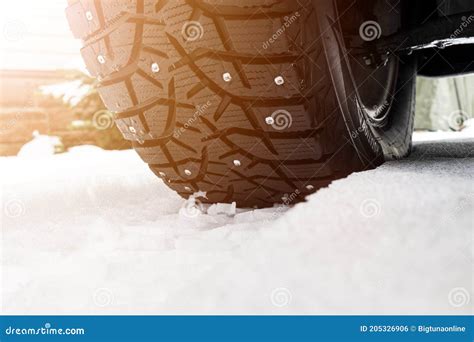 Car Tire In The Snow Close Up Car Tracks On The Snow Traces Of The