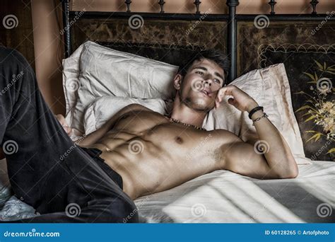 Shirtless Male Model Lying Alone On His Bed Stock Image Image Of
