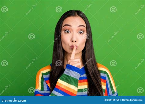 close up portrait of attractive mysterious girl showing shh sign keep silence isolated over