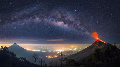 The Milky Way Coming Out Of An Erupting Volcano 1366x768 Rwallpapers
