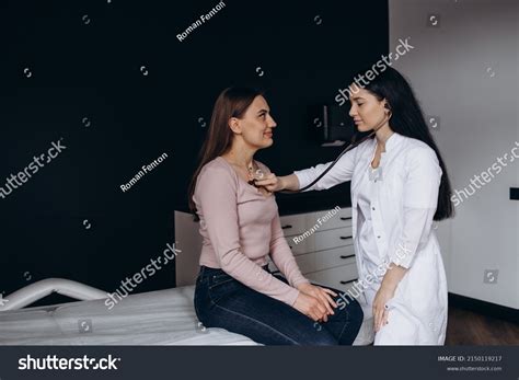 Doctor Listening Heartbeat Her Young Patient Stock Photo 2150119217