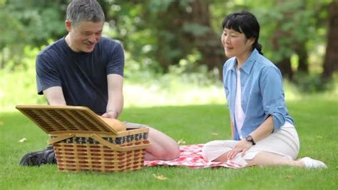 Mature Asian Couple Having A Picnic Together By Viafilms On Envato Elements